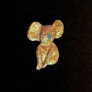 Goldtone koala brooch with rhinestone eyes and opal nose